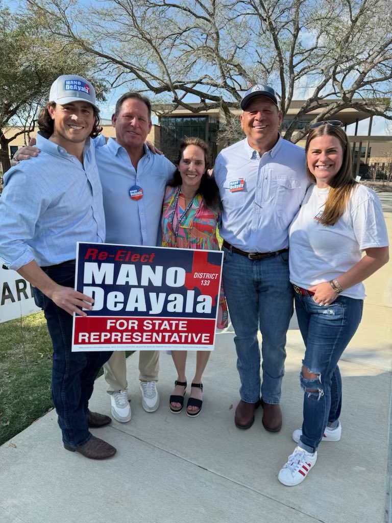 Mano DeAyala’s March 5, 2024 poll photo. Ashley Zahn stands at the right of the group beside a Re-Elect Mano DeAyala sign.